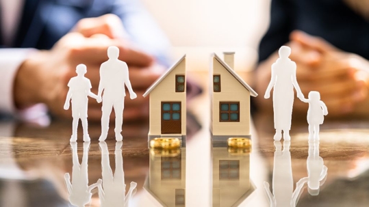 cutouts of a family with a divided home