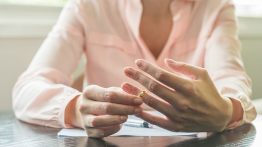 Woman removing her wedding ring