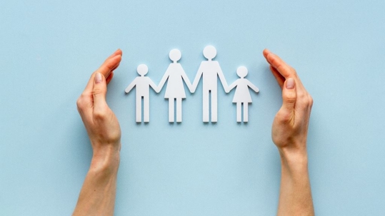 Paper cutouts of a family with kids